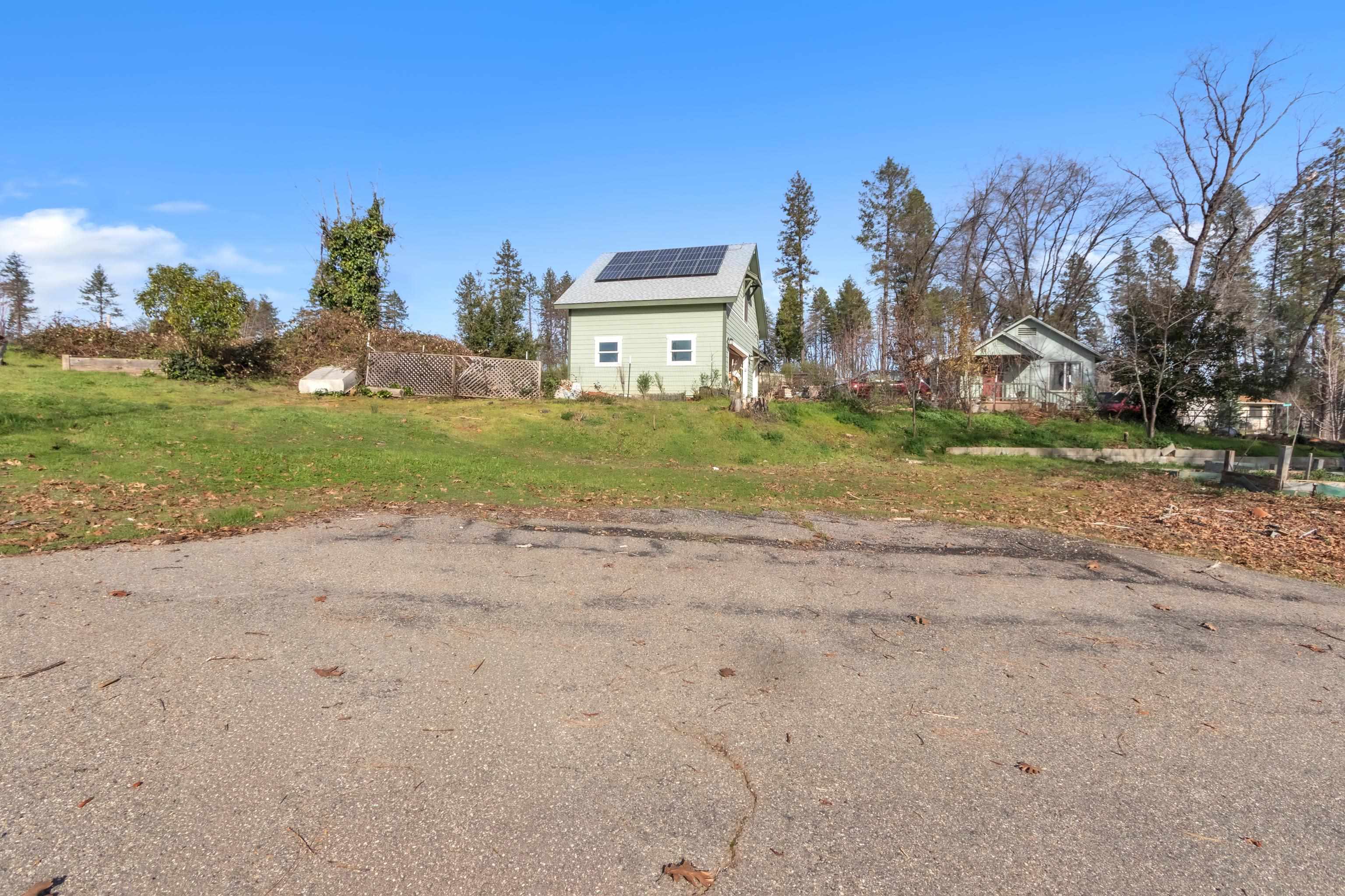 6251 Harvey Road Paradise, CA 95969 - Photo 36 of 48 a view of a house with a yard and pathway
