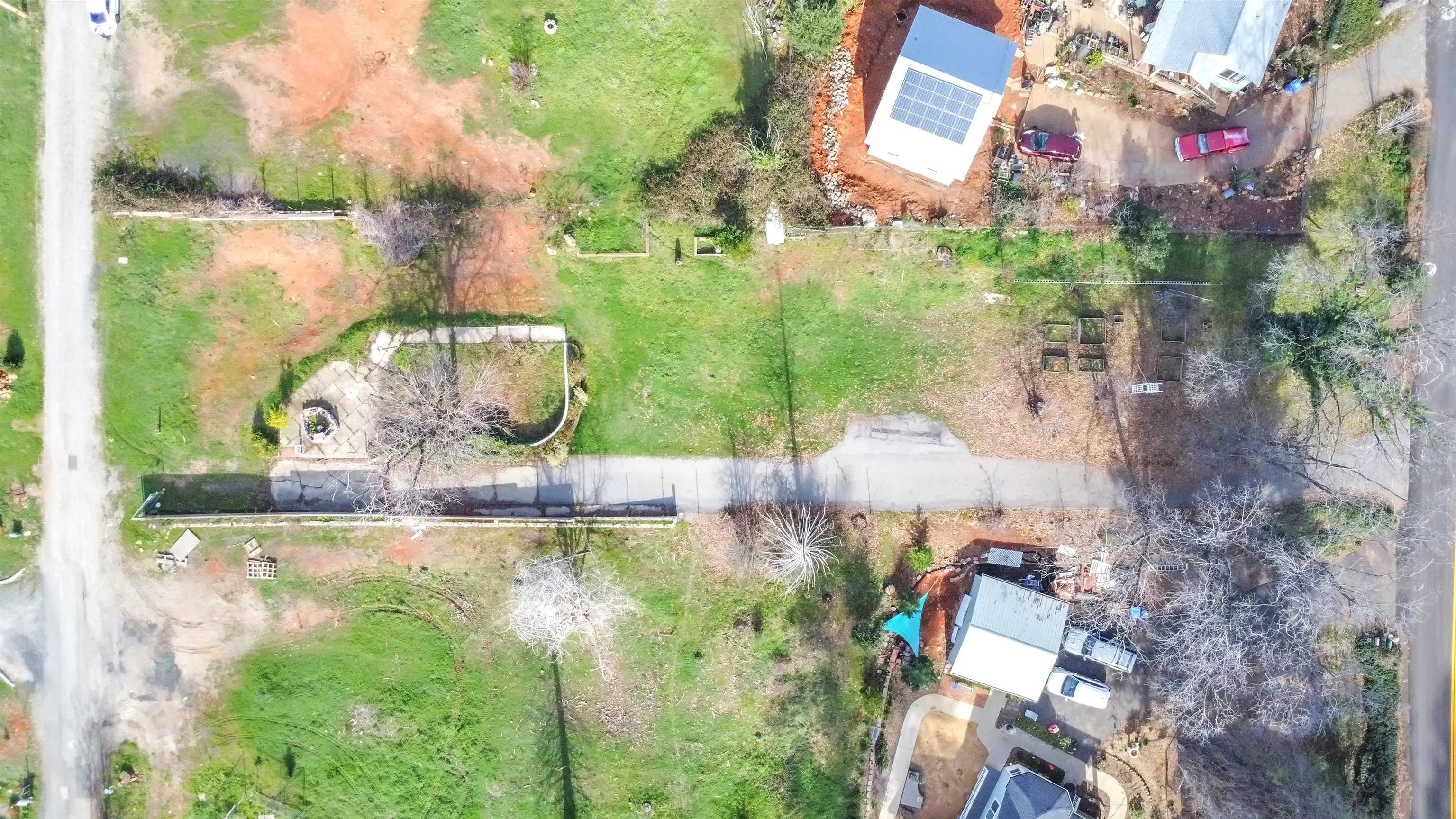 6251 Harvey Road Paradise, CA 95969 - Photo 5 of 48 an aerial view of a house with a yard and lake view