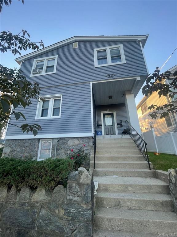42 Haviland Street, Unit 1 Harrison, NY 10528 - Photo 1 of 1 a view of a brick house with a large windows