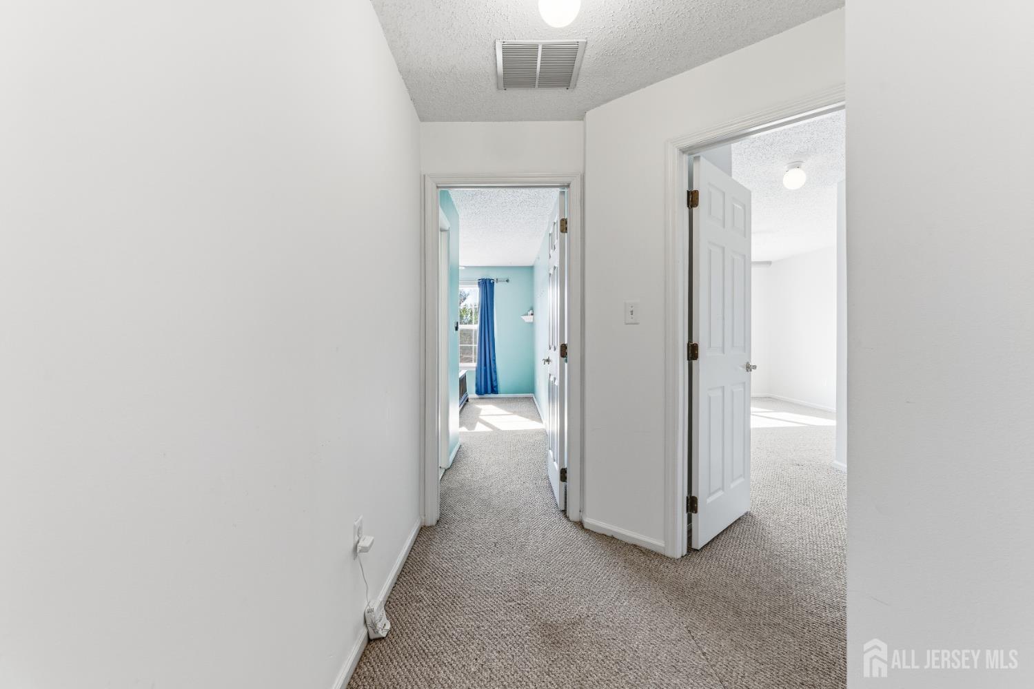 21 Newburgh Drive Edison, NJ 08820 - Photo 13 of 31 a view of a hallway with an empty room