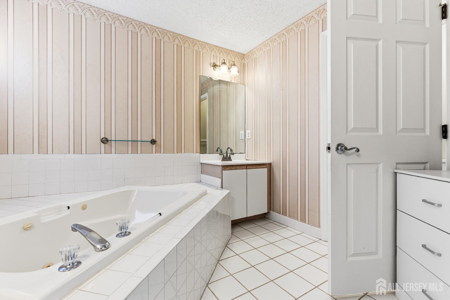 21 Newburgh Drive Edison, NJ 08820 - Photo 17 of 31 a bathroom with a bathtub and a shower