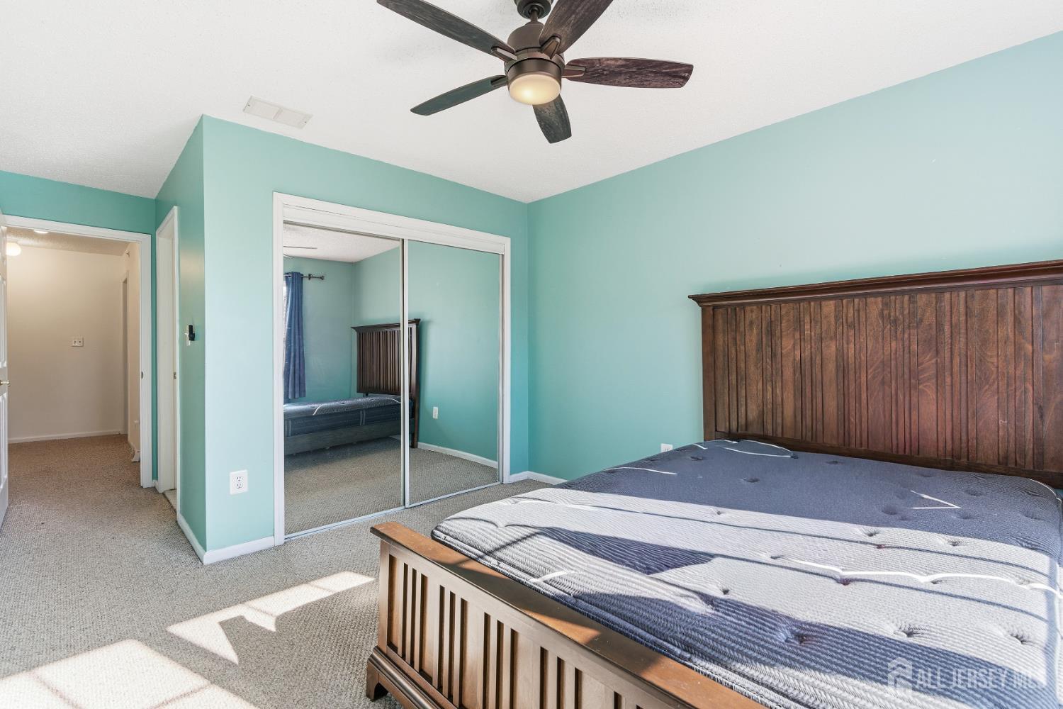 21 Newburgh Drive Edison, NJ 08820 - Photo 19 of 31 a bedroom with a bed and a chandelier