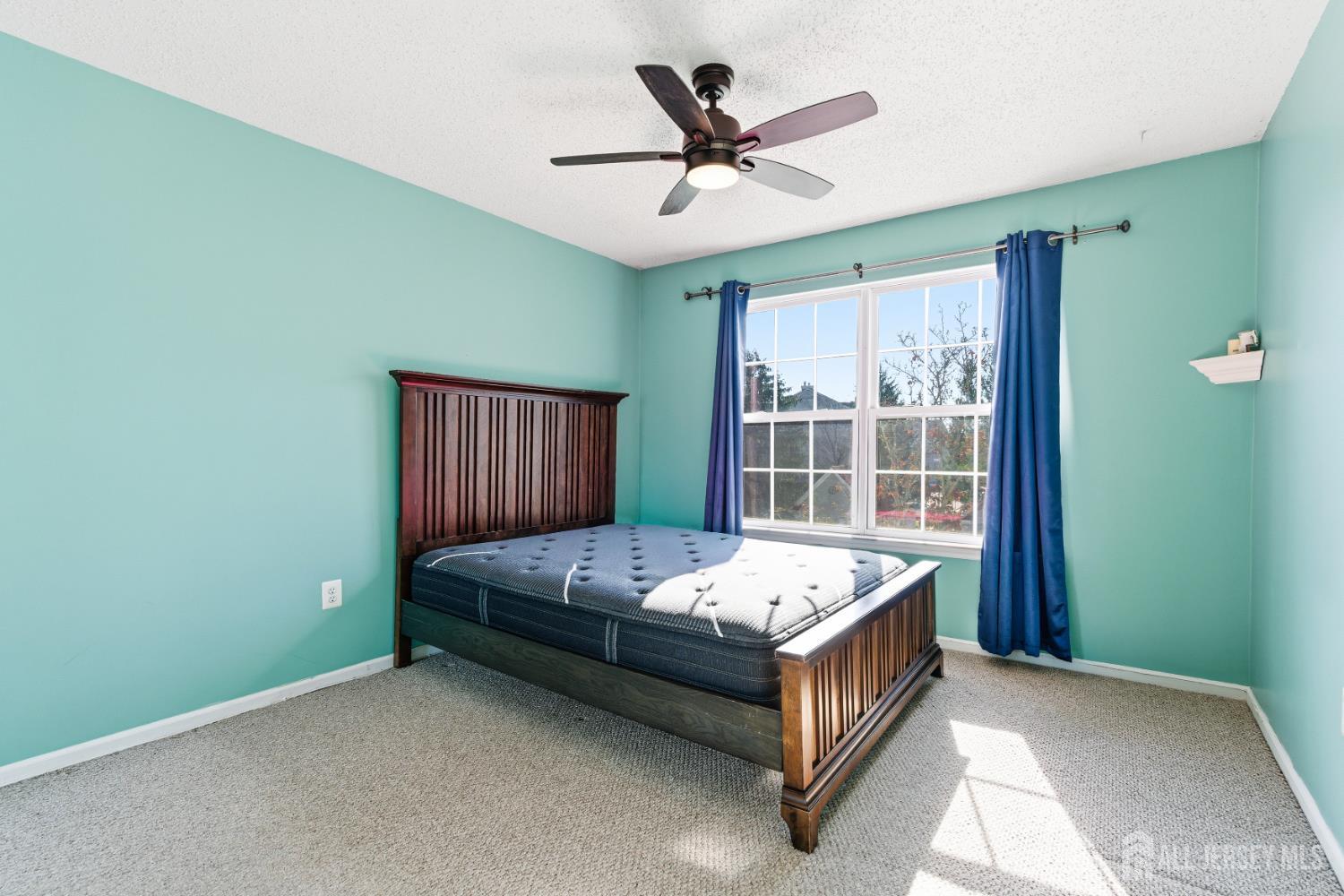 21 Newburgh Drive Edison, NJ 08820 - Photo 20 of 31 a bed room with a bed and a window