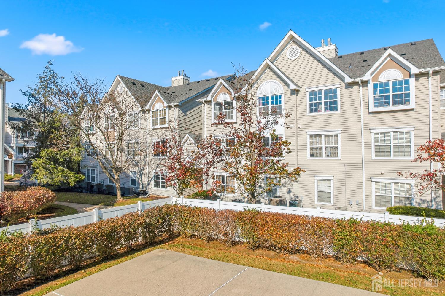 21 Newburgh Drive Edison, NJ 08820 - Photo 25 of 31 a view of a white house with a large windows and palm trees