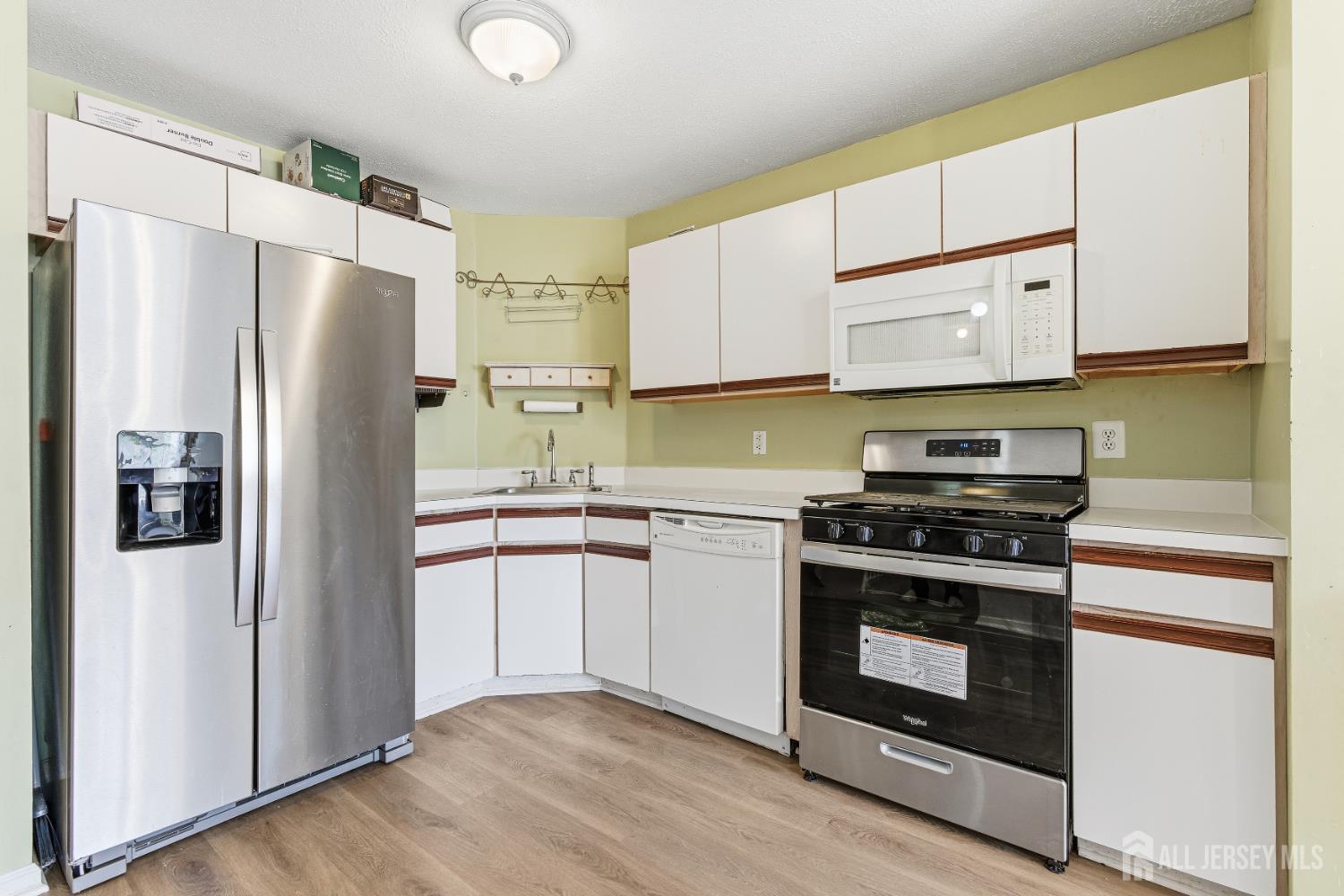 21 Newburgh Drive Edison, NJ 08820 - Photo 7 of 31 a kitchen with stainless steel appliances granite countertop a refrigerator stove and a sink