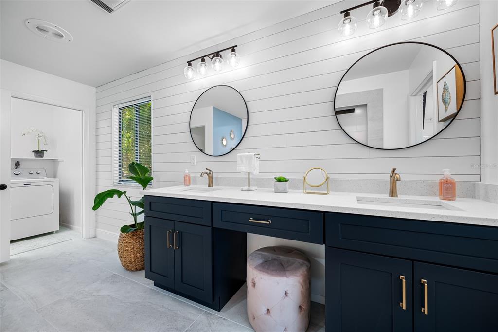 2153 Karan Way Clearwater, FL 33763 - Photo 36 of 65 a bathroom with a double vanity sink and a mirror
