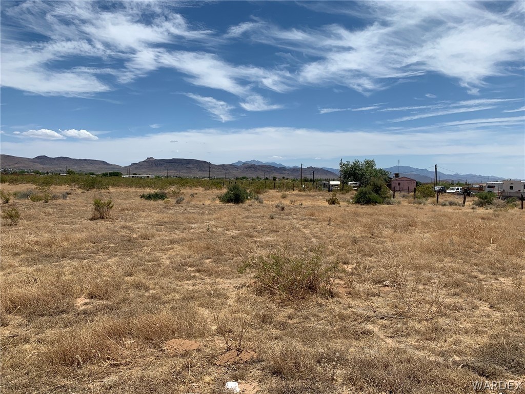 3468 Mobile Road Golden Valley, AZ 86413 - Photo 1 of 11 a view of lake with mountain