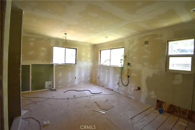 a view of a hallway with wooden shelves