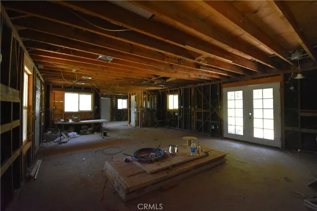 a lobby with furniture and window