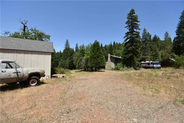 a view of street with parked cars