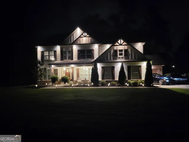 a front view of a house with a yard