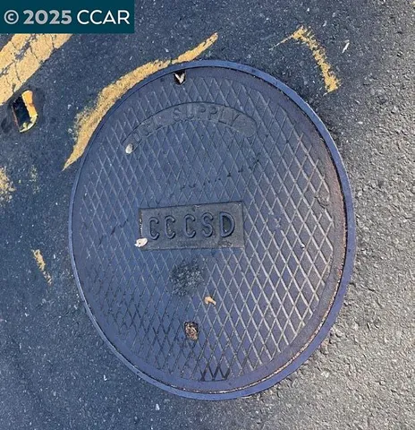 a large stone wall with a dry yard