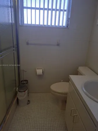 a bathroom with a toilet and a sink