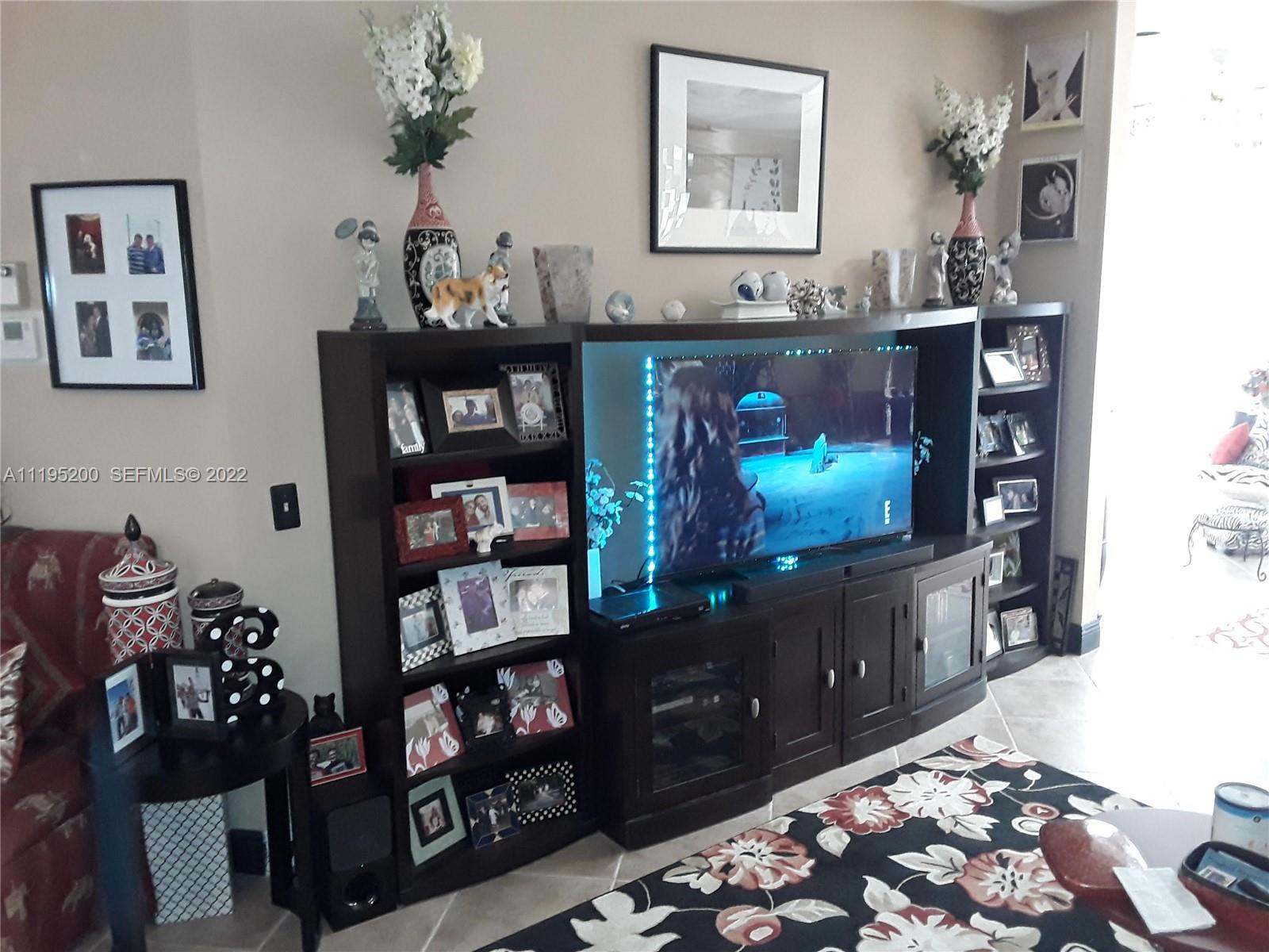6810 Via Regina, Unit 40 Boca Raton, FL 33433 - Photo 15 of 45 Living Room 3 of 4. Entertainment Center