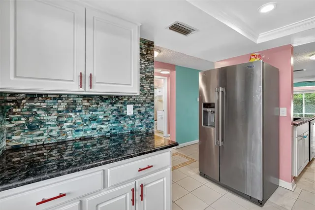 a kitchen with stainless steel appliances a stove and a refrigerator