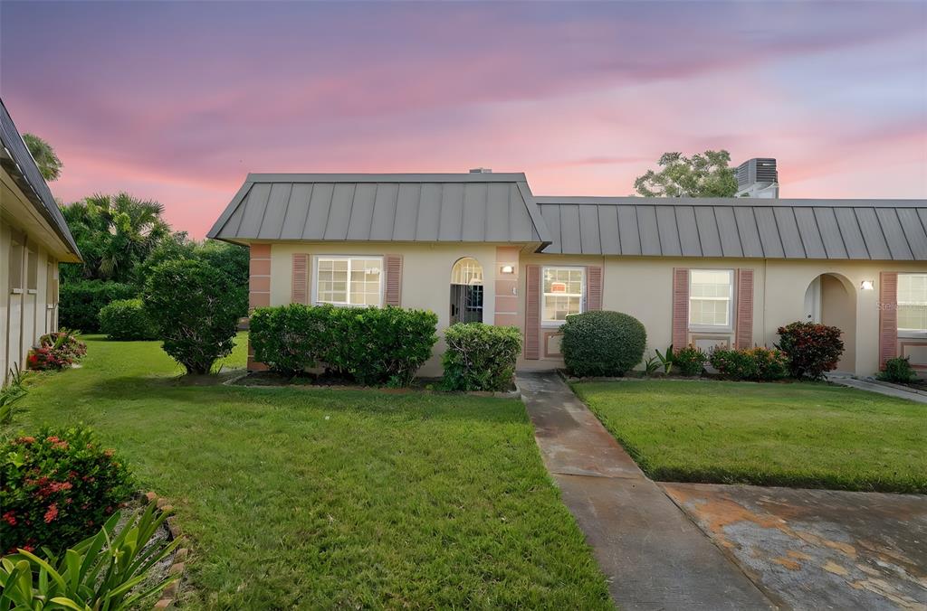 4301 Summersun Drive, Unit A New Port Richey, FL 34652 - Photo 2 of 35 a front view of a house with a yard