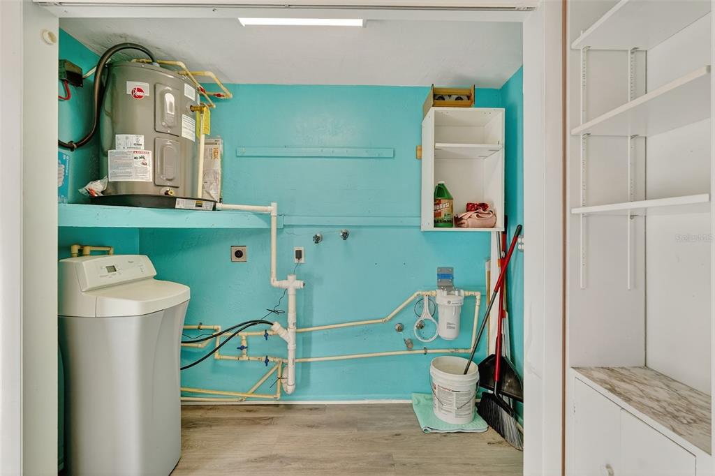 4301 Summersun Drive, Unit A New Port Richey, FL 34652 - Photo 22 of 35 a bathroom with a sink mirror and a toilet