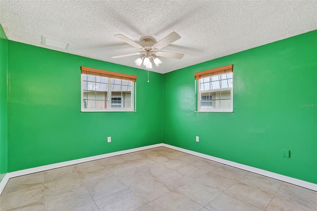 4301 Summersun Drive, Unit A New Port Richey, FL 34652 - Photo 29 of 35 a view of empty room with window and ceiling fan