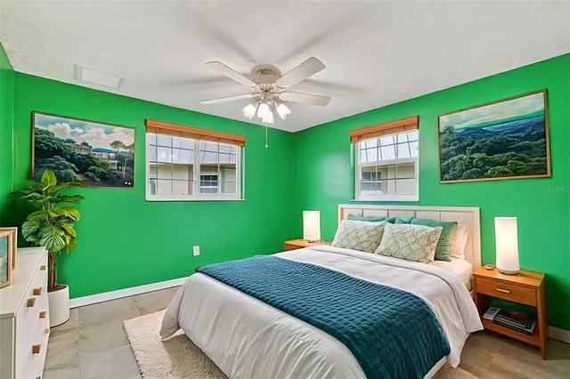 an empty room with closet and fan