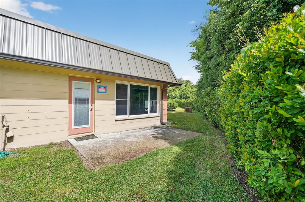 4301 Summersun Drive, Unit A New Port Richey, FL 34652 - Photo 32 of 35 a view of a house with a backyard