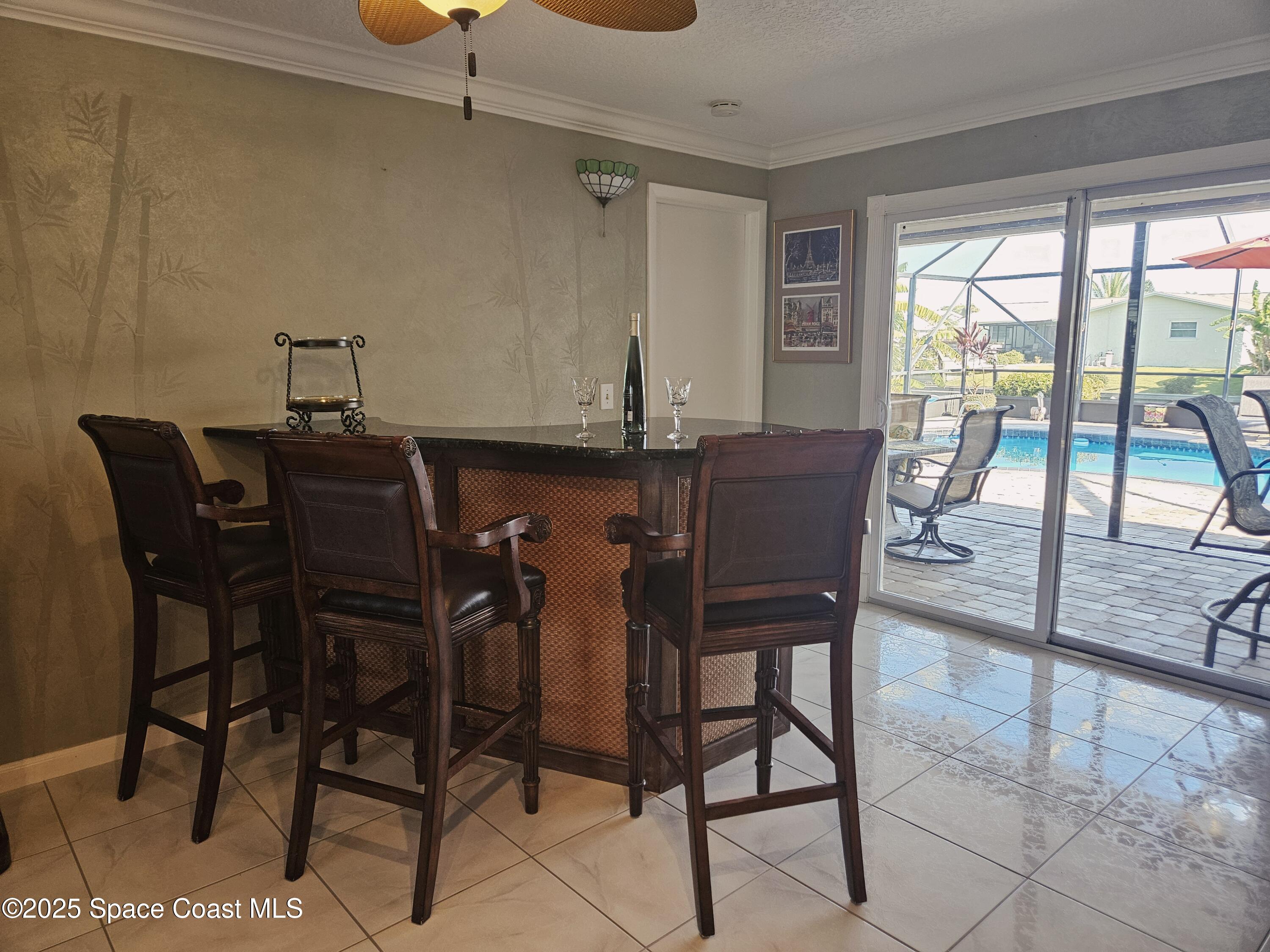 1525 West Riviera Drive Merritt Island, FL 32952 - Photo 13 of 47 a dining room with furniture and window