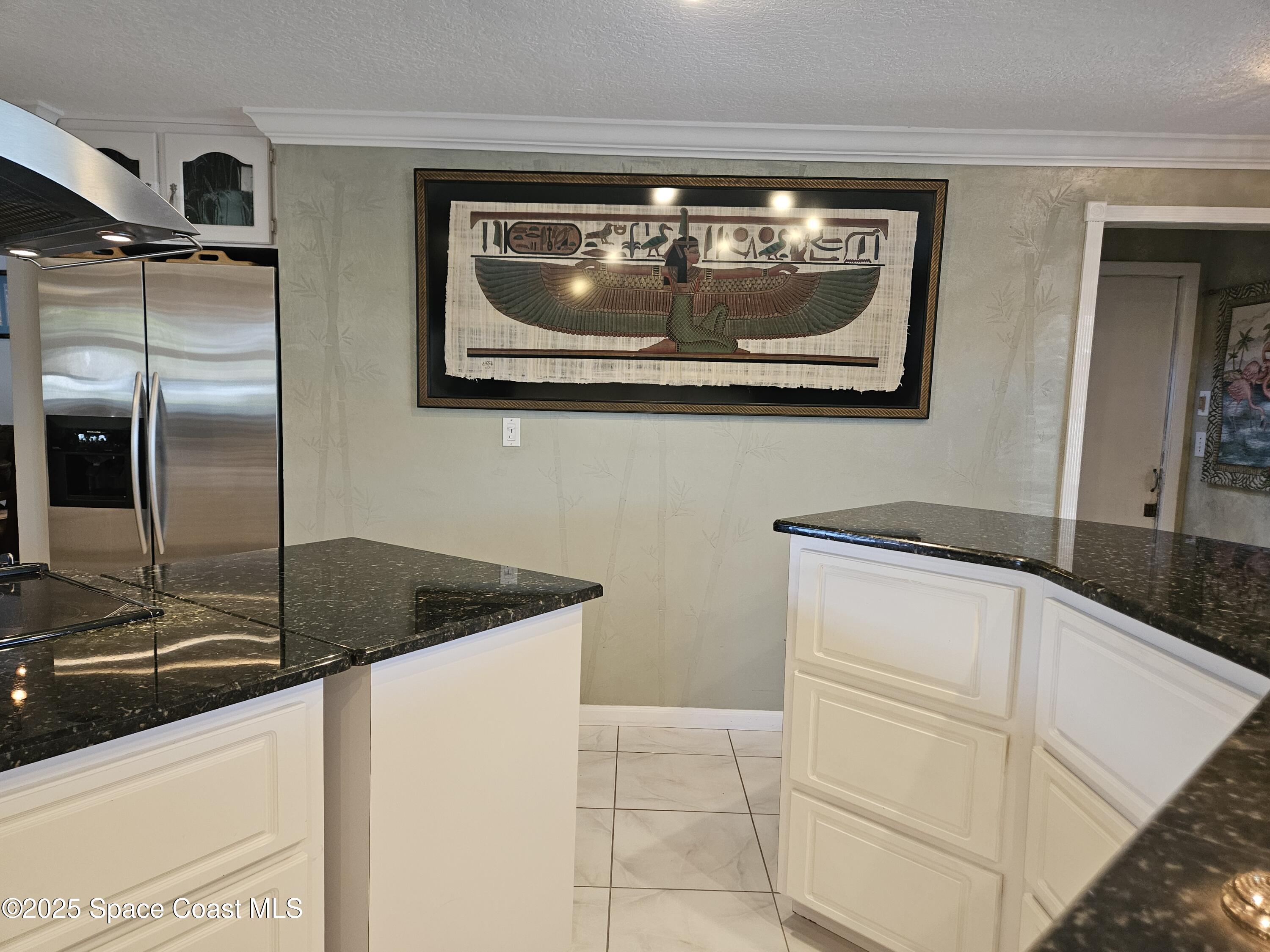 1525 West Riviera Drive Merritt Island, FL 32952 - Photo 20 of 47 a kitchen with granite countertop a sink and a stainless steel appliances