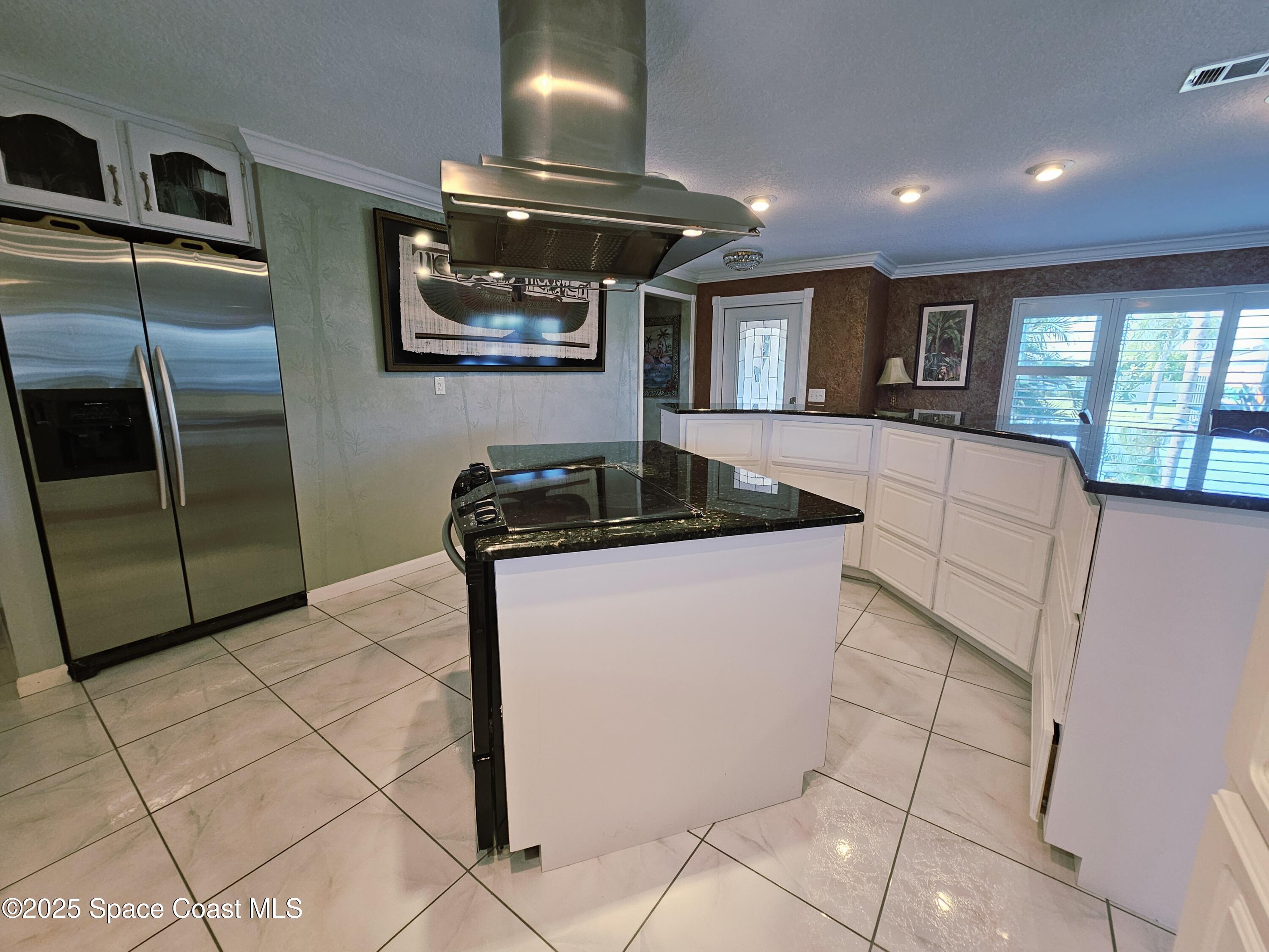 1525 West Riviera Drive Merritt Island, FL 32952 - Photo 21 of 47 a living room with granite countertop furniture and a fireplace