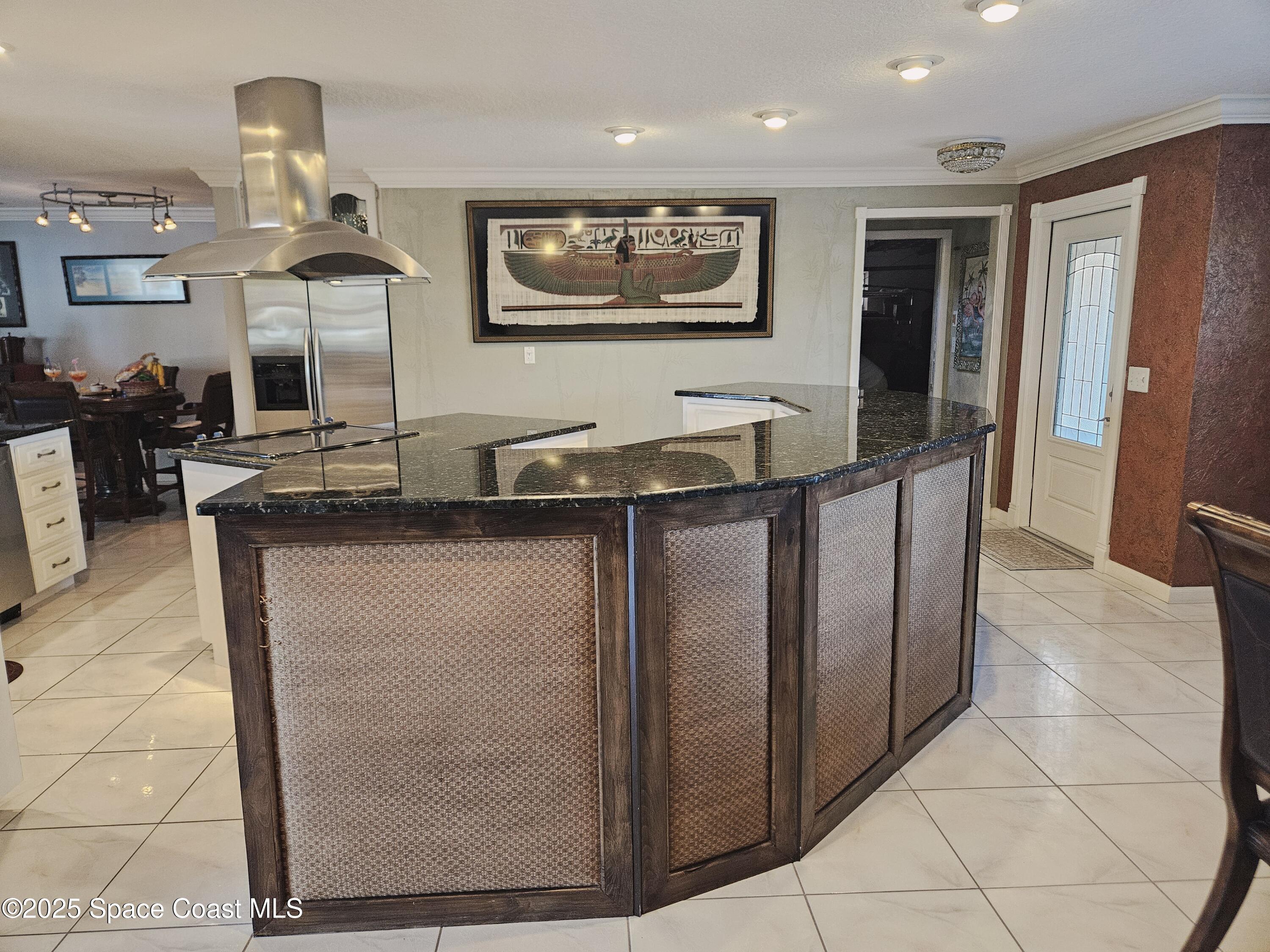 1525 West Riviera Drive Merritt Island, FL 32952 - Photo 23 of 47 a kitchen with stainless steel appliances granite countertop a sink and a refrigerator
