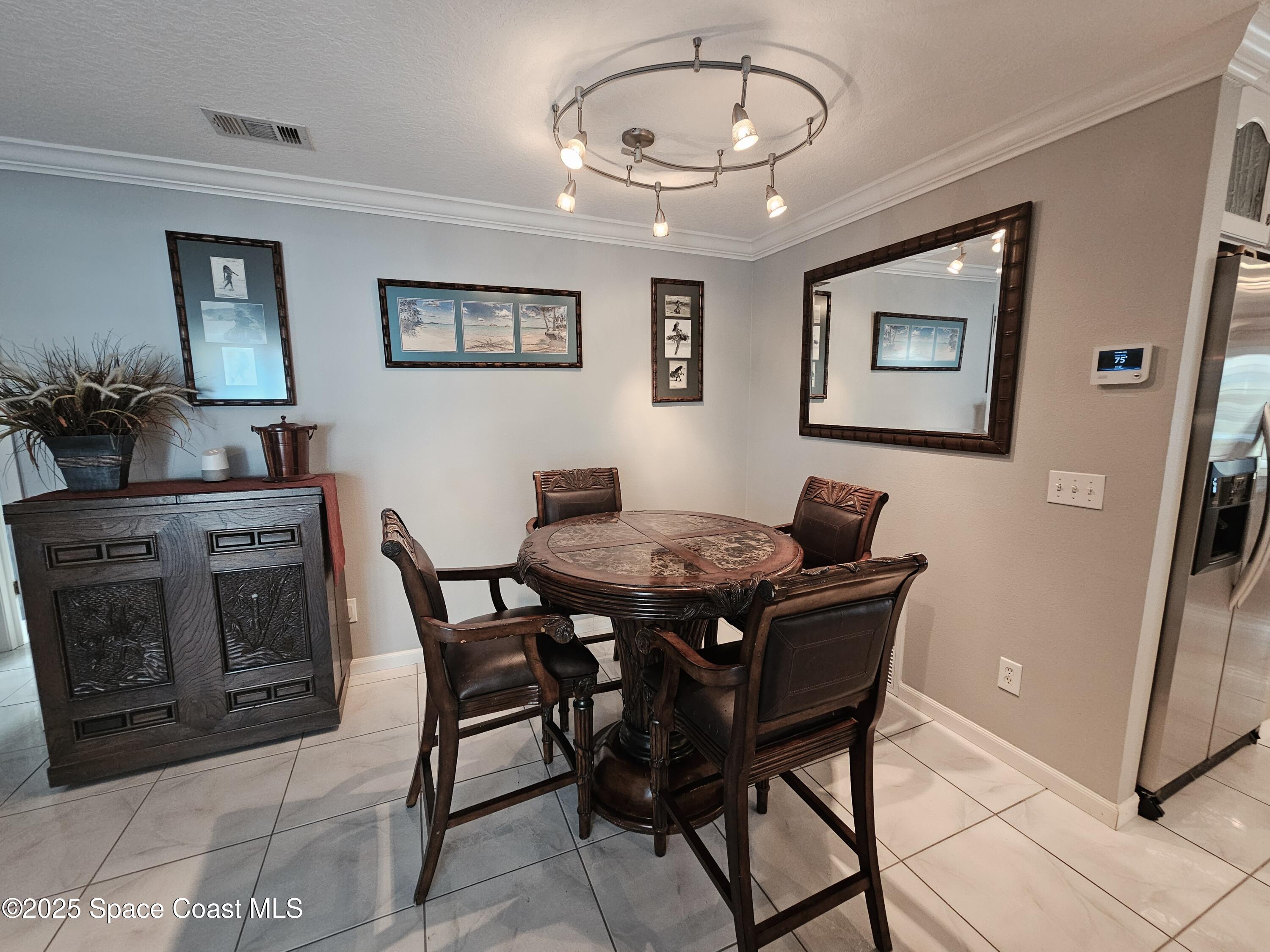 1525 West Riviera Drive Merritt Island, FL 32952 - Photo 24 of 47 a view of a dining room with furniture