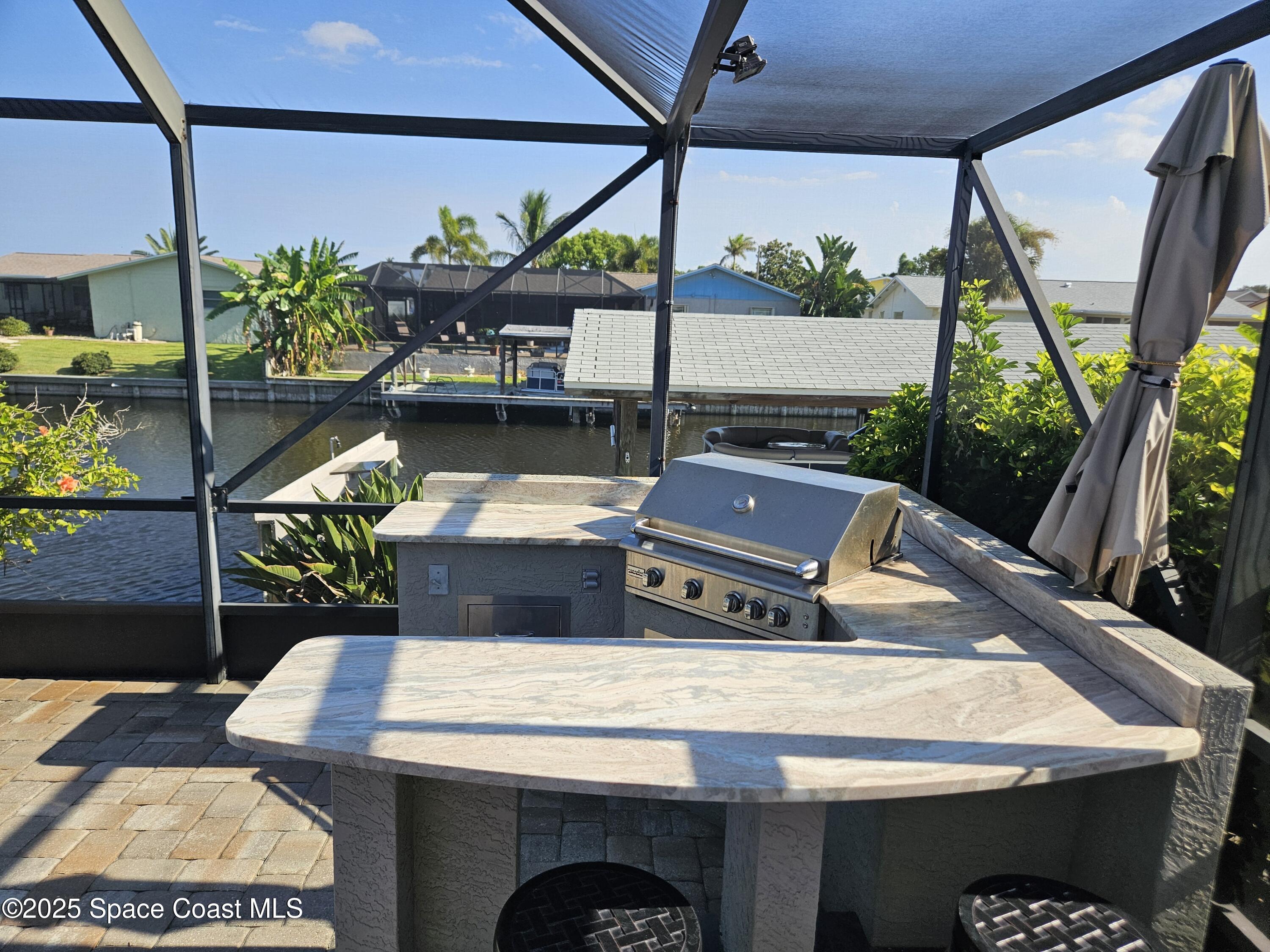 1525 West Riviera Drive Merritt Island, FL 32952 - Photo 31 of 47 a view of outdoor space with seating area
