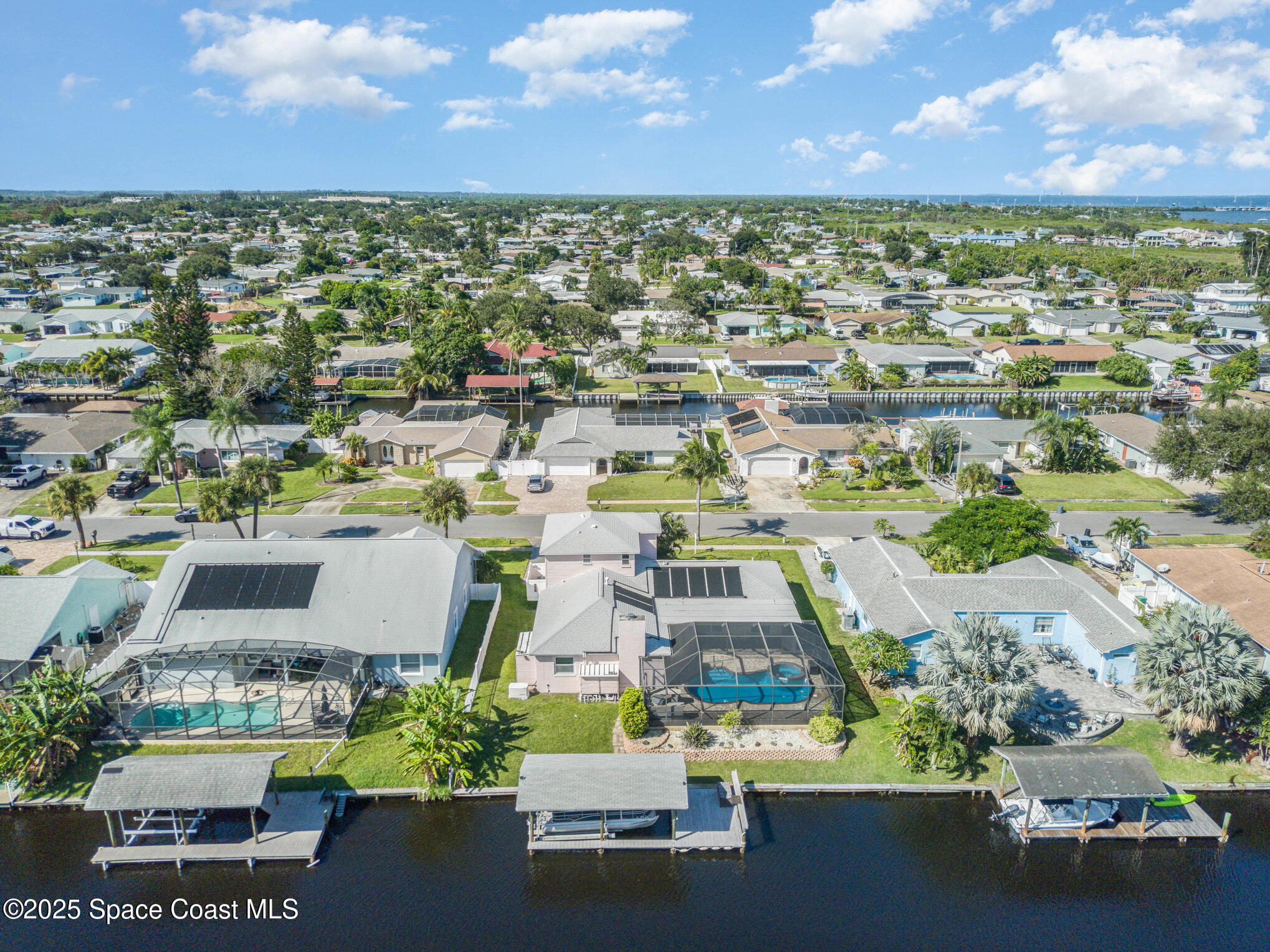 1525 West Riviera Drive Merritt Island, FL 32952 - Photo 44 of 47 an aerial view of a houses with outdoor space