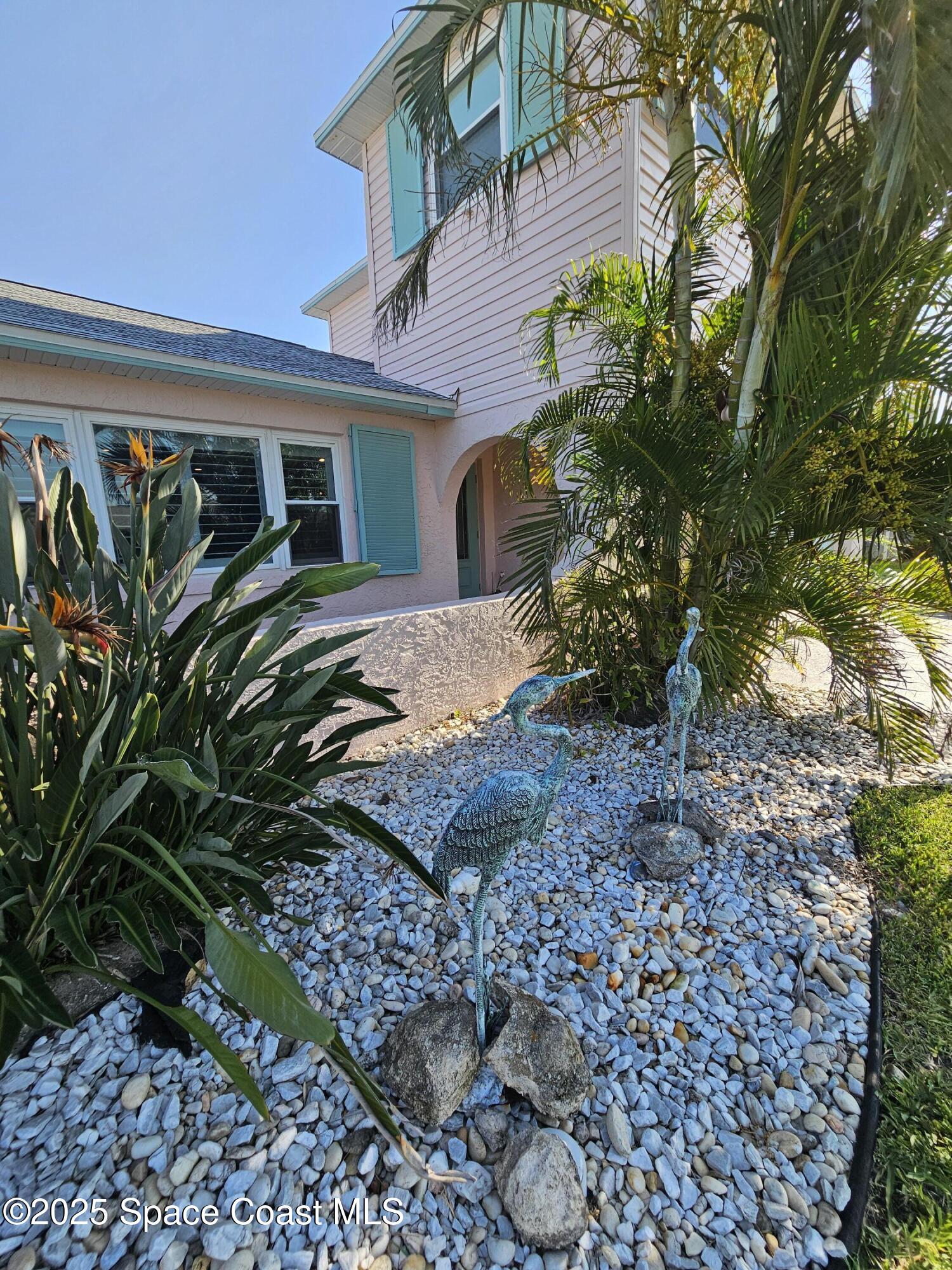 1525 West Riviera Drive Merritt Island, FL 32952 - Photo 8 of 47 a view of a house with a yard