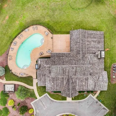 an aerial view of a house with garden space ocean view