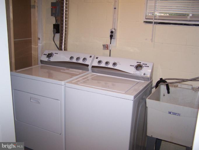 8908 Crandall Road Lanham, MD 20706 - Photo 13 of 30 Utility Room w/ New Washer & Dryer