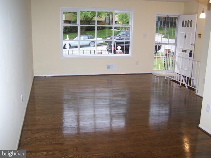 8908 Crandall Road Lanham, MD 20706 - Photo 17 of 30 Living Room w/ gleaming HWF