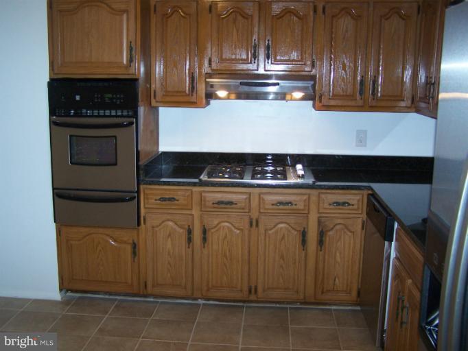 8908 Crandall Road Lanham, MD 20706 - Photo 3 of 30 Kitchen w/ new granite top & ceramic floors