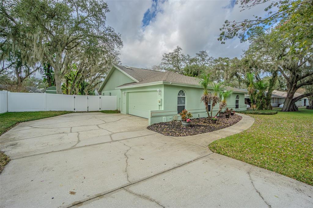 7708 Merrily Way Lakeland, FL 33809 - Photo 2 of 41 a view of a house with backyard and trees