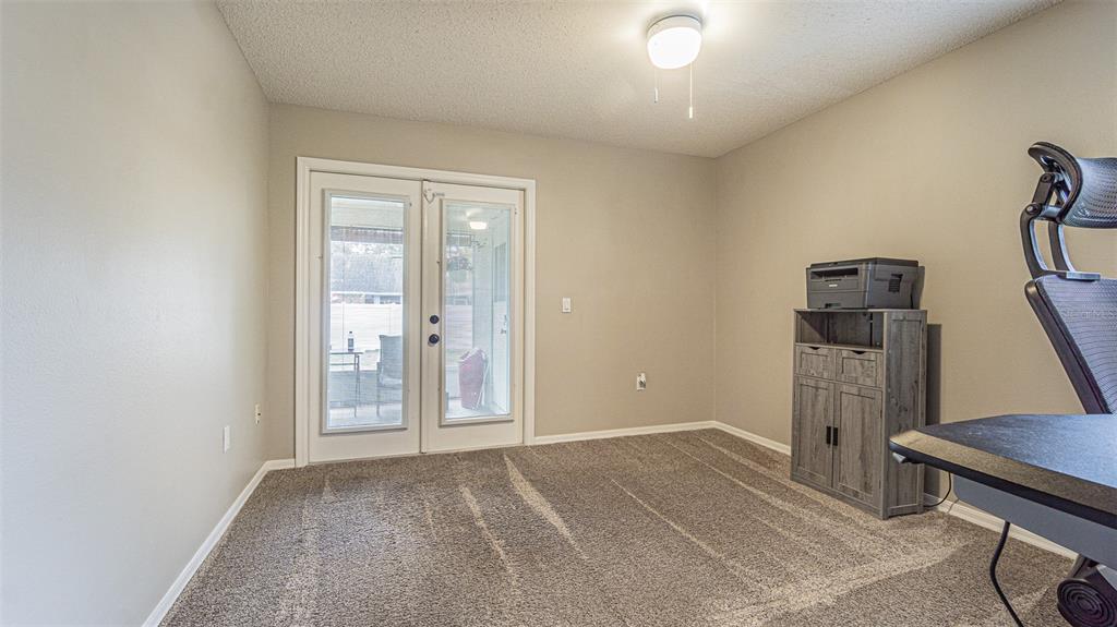 7708 Merrily Way Lakeland, FL 33809 - Photo 25 of 41 a view of a room with gym equipment