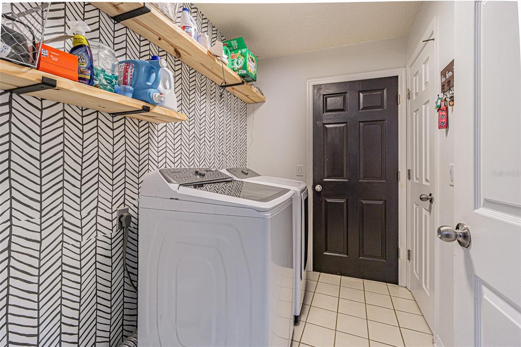 7708 Merrily Way Lakeland, FL 33809 - Photo 29 of 41 a utility room with dryer and washer