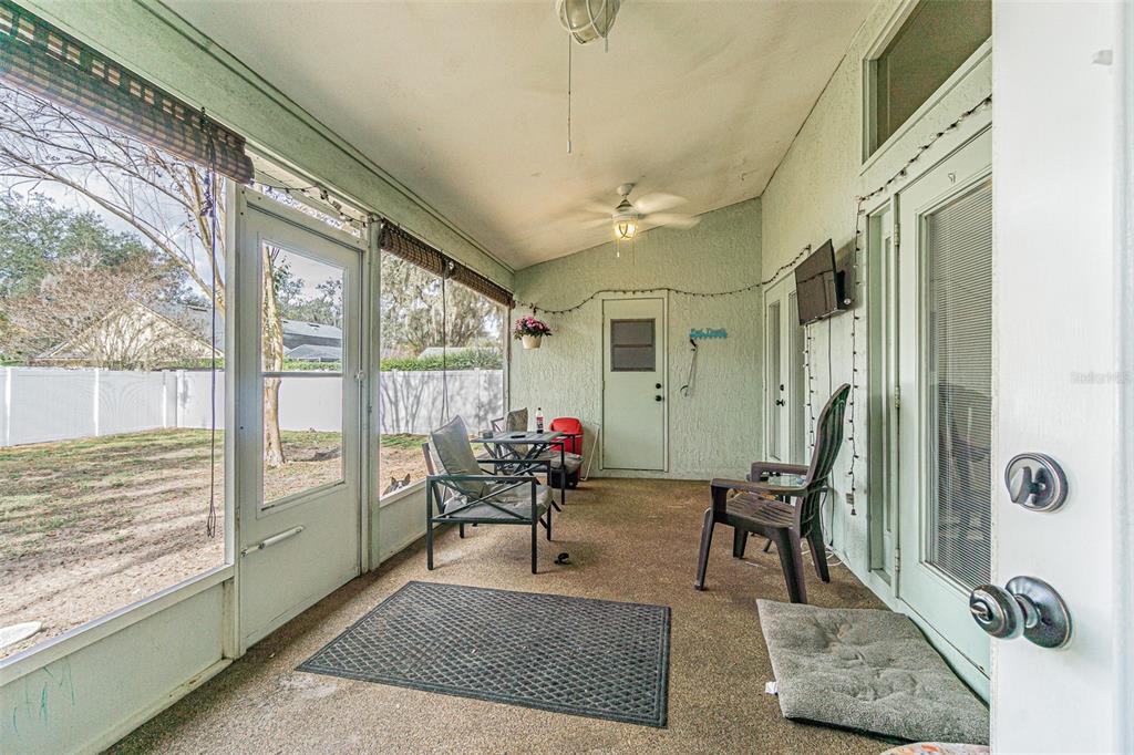 7708 Merrily Way Lakeland, FL 33809 - Photo 30 of 41 a living room with furniture and a large window