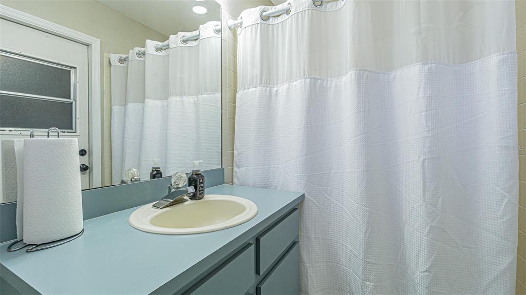 7708 Merrily Way Lakeland, FL 33809 - Photo 32 of 41 a bathroom with a sink and a mirror