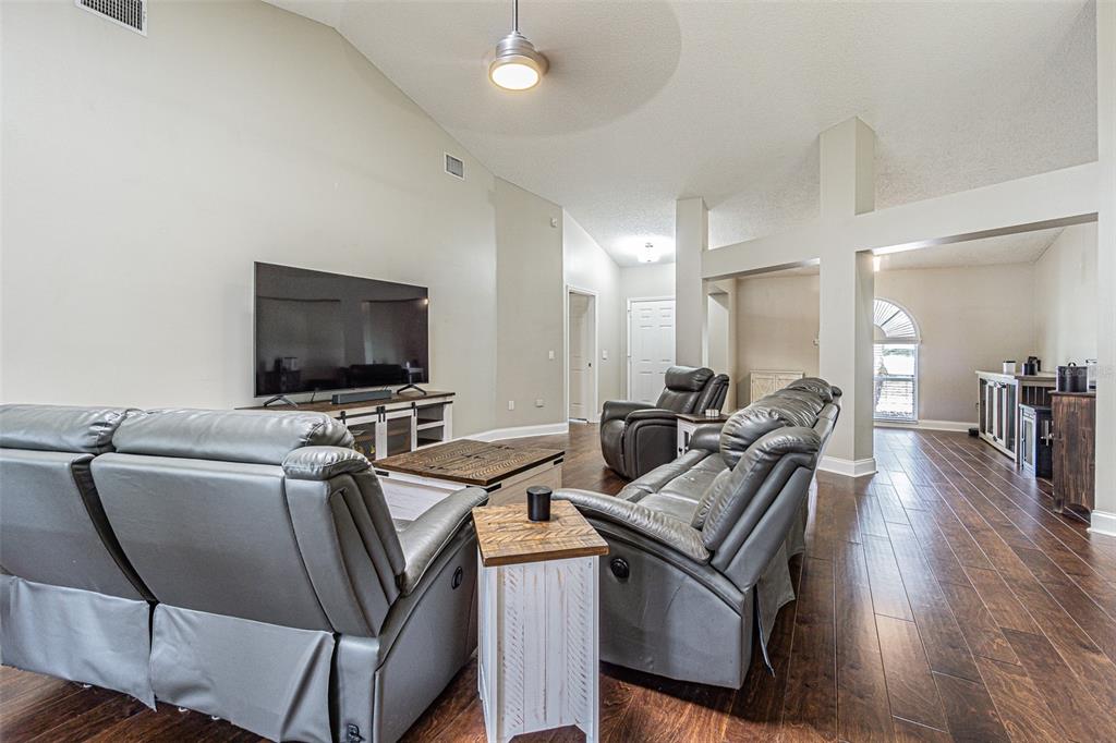 7708 Merrily Way Lakeland, FL 33809 - Photo 9 of 41 a view of a workspace with furniture and wooden floor