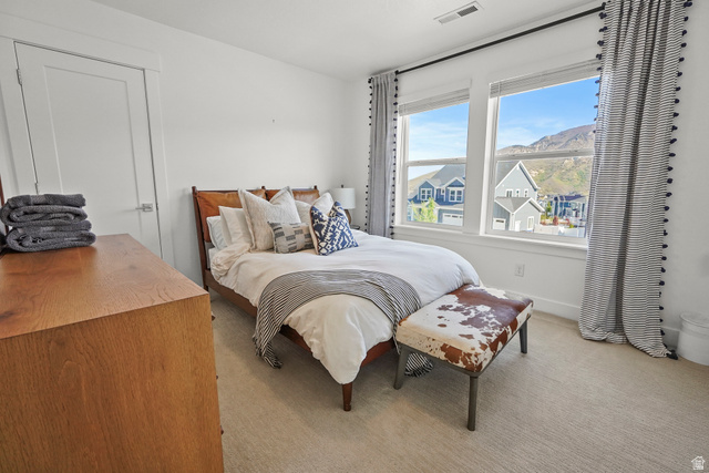15008 South Springtime Road Draper, UT 84020 - Photo 25 of 37 Bedroom with light carpet and a mountain view