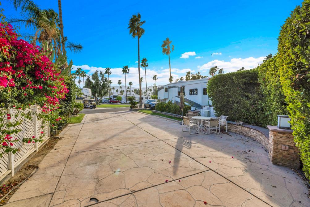 69411 Ramon Road, Unit 362 Cathedral City, CA 92234 - Photo 4 of 13 a view of a patio with a table and chairs