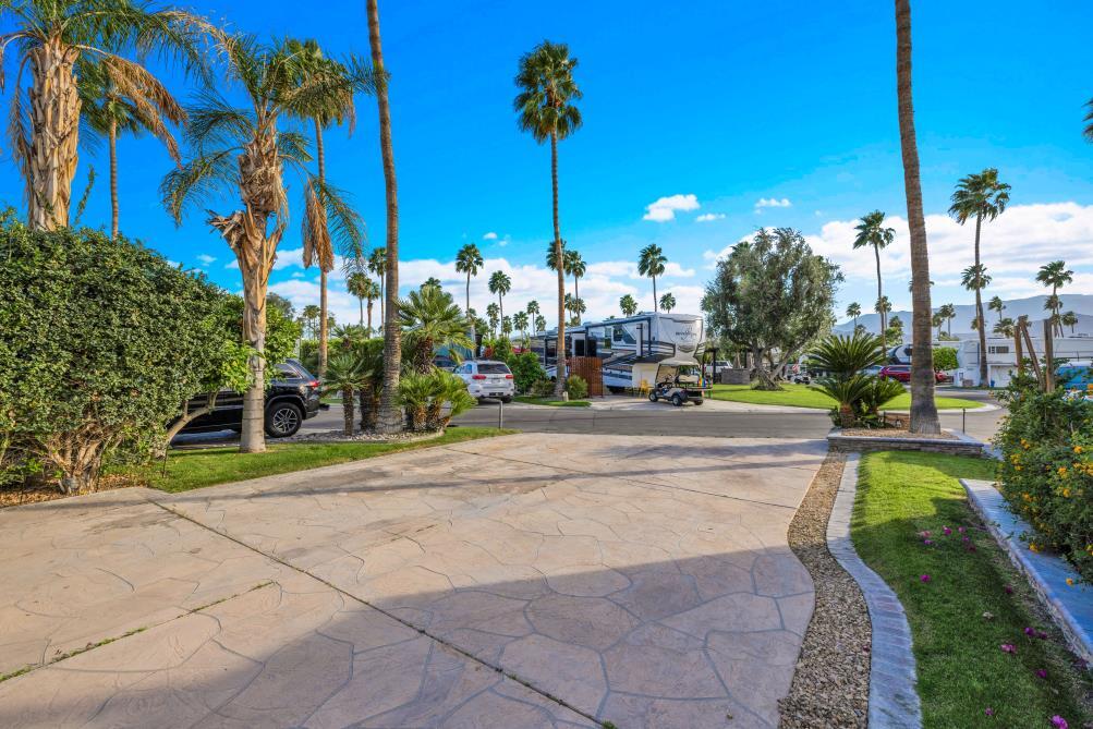 69411 Ramon Road, Unit 362 Cathedral City, CA 92234 - Photo 5 of 13 a view of a house with a swimming pool and sitting area
