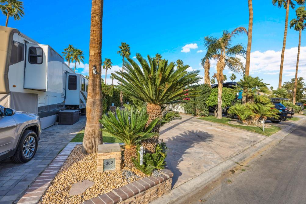 69411 Ramon Road, Unit 362 Cathedral City, CA 92234 - Photo 8 of 13 a view of a house with a yard and sitting area