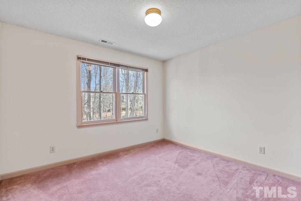 1014 Boathouse Court Raleigh, NC 27615 - Photo 23 of 41 an empty room with windows