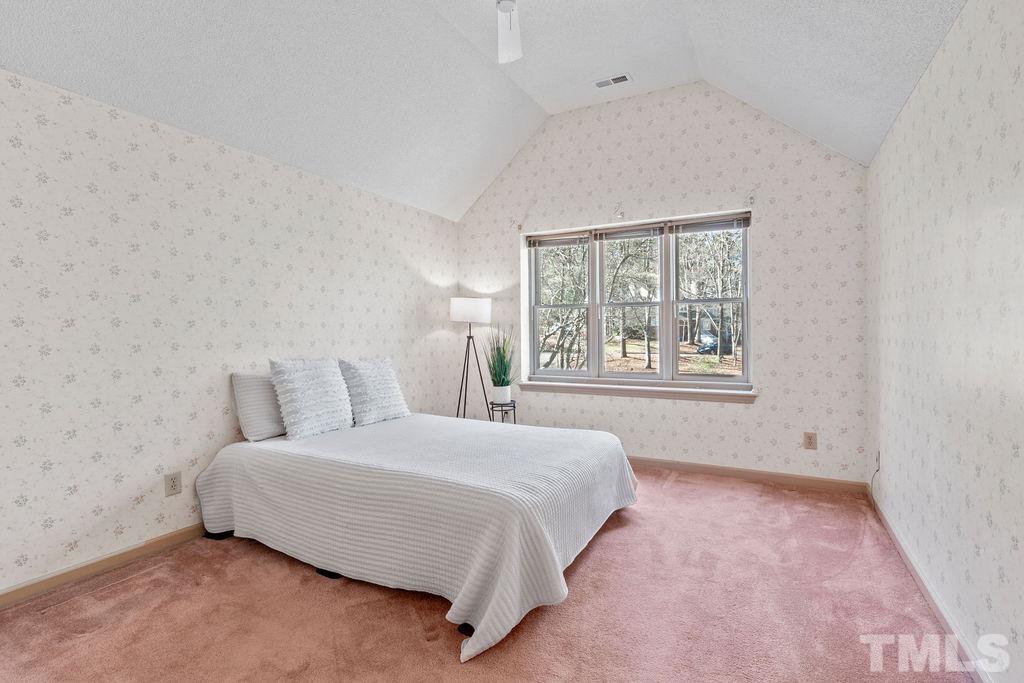 1014 Boathouse Court Raleigh, NC 27615 - Photo 27 of 41 a bedroom with a bed and a window