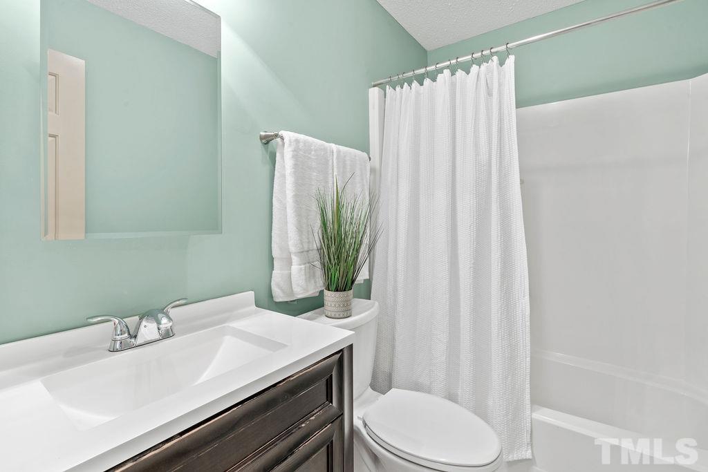 1014 Boathouse Court Raleigh, NC 27615 - Photo 29 of 41 a bathroom with a sink toilet and shower