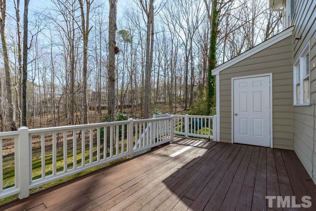 1014 Boathouse Court Raleigh, NC 27615 - Photo 30 of 41 a view of a deck with wooden floor and fence